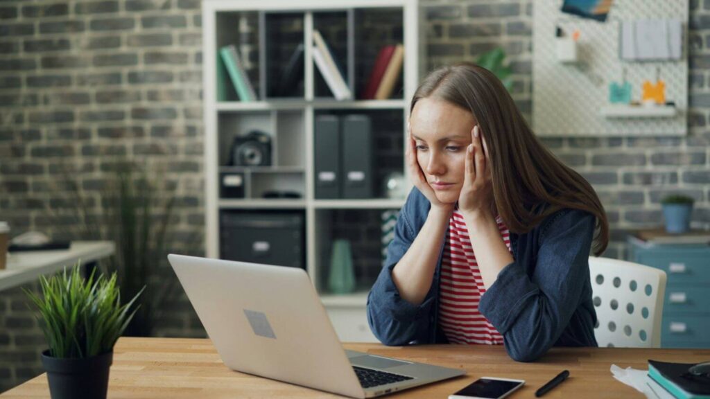 stressed out phd student at desk