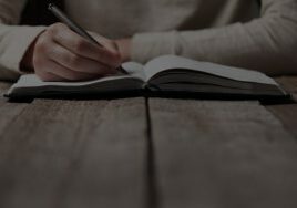 writing in a notebook