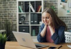 stressed out phd student at desk